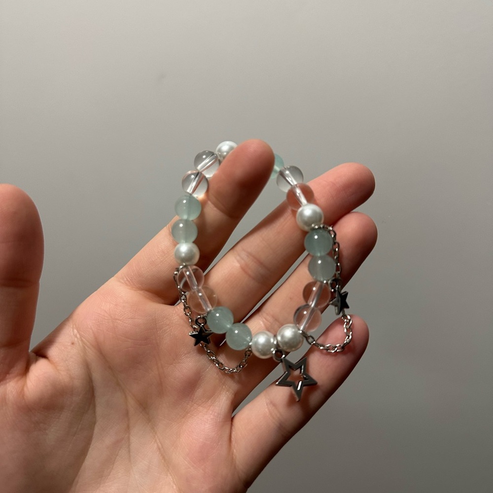 Handmade glass bead bracelet with star charms
